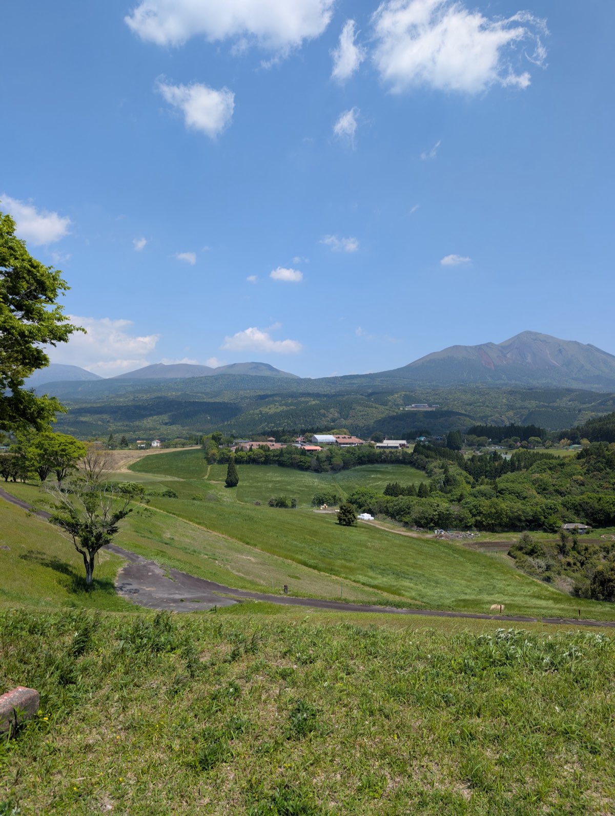 Green fields below the mountains of Kirishima